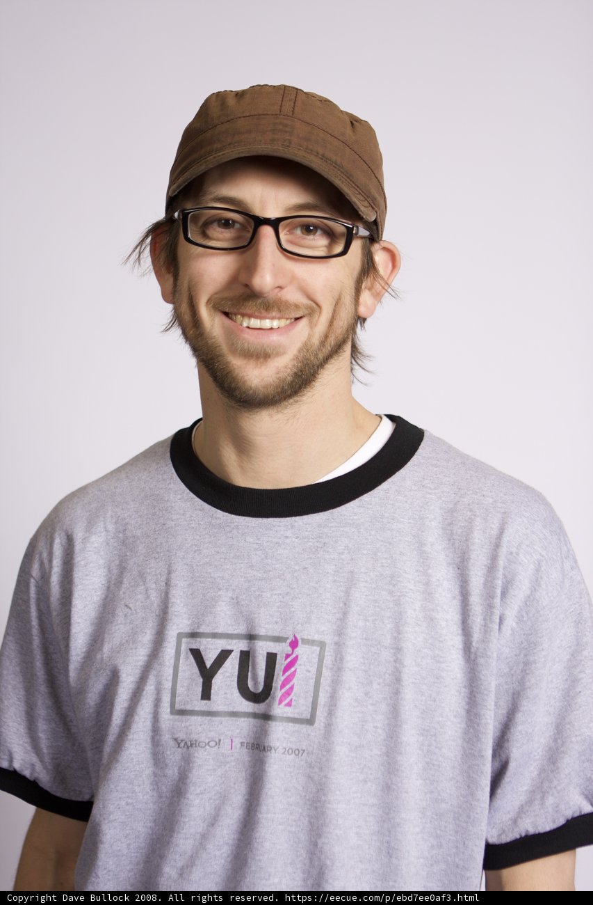 Happy man in a grey t-shirt and baseball cap