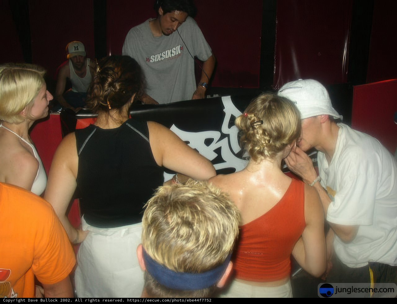 Gathering Around the White-Shirted Man