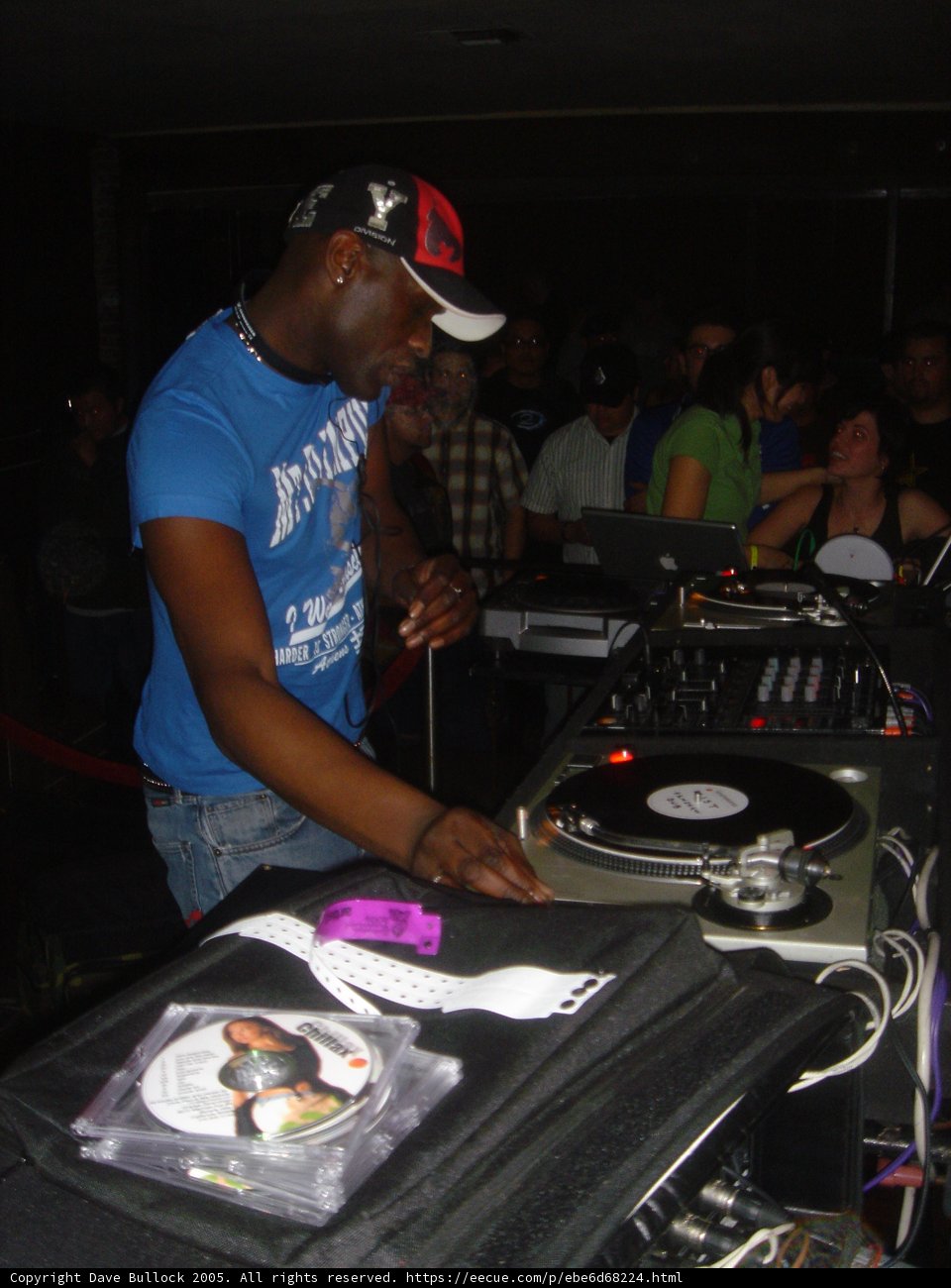 Blue Shirted Deejay Spins the Record
