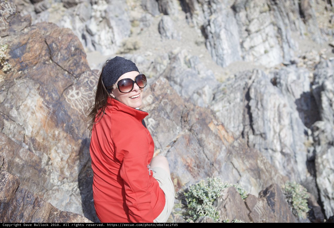 Smiling Hiker Posed Against Desert Canyon Rocks
