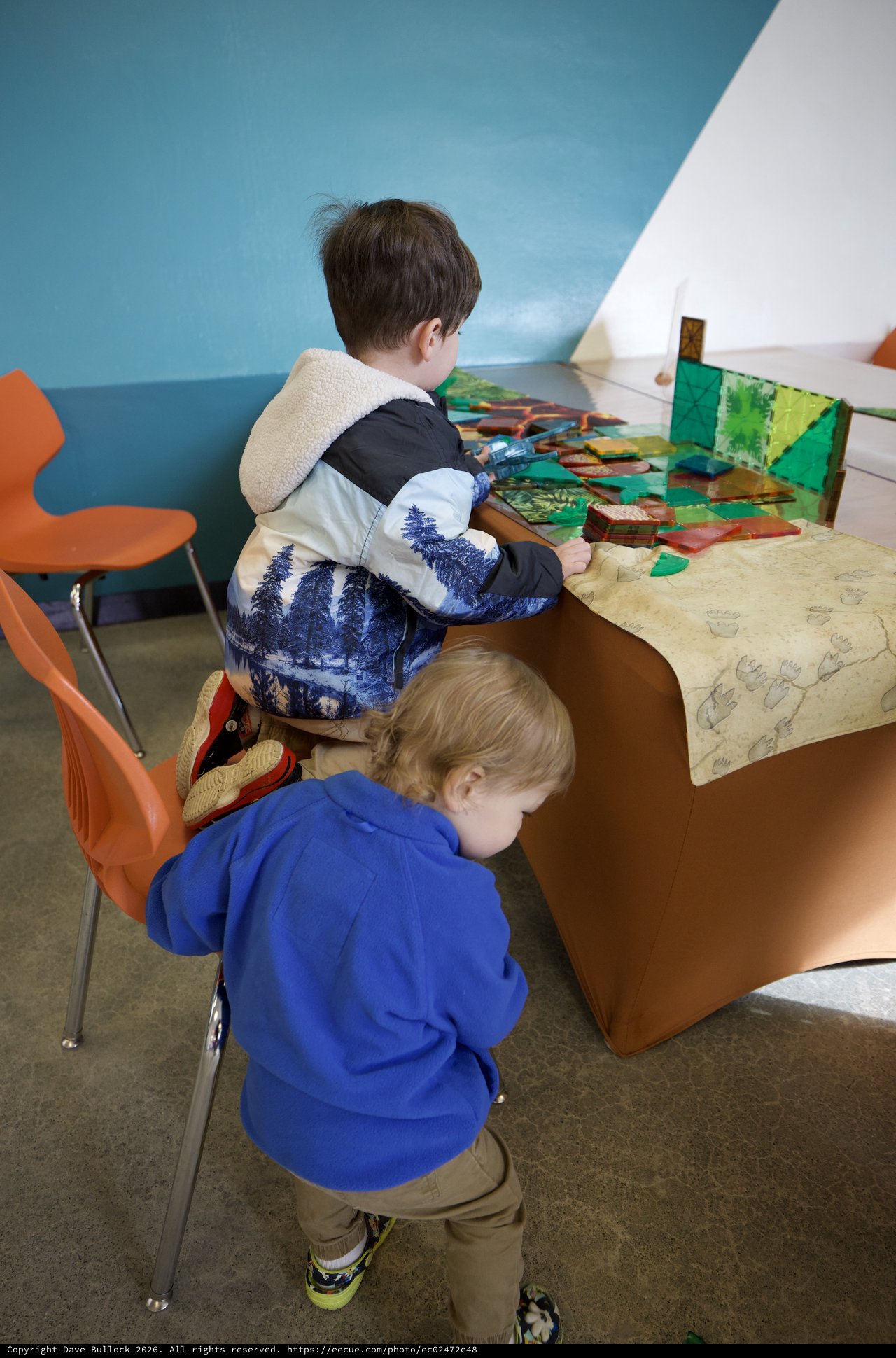 Children Exploring Interactive Exhibit at Play Space