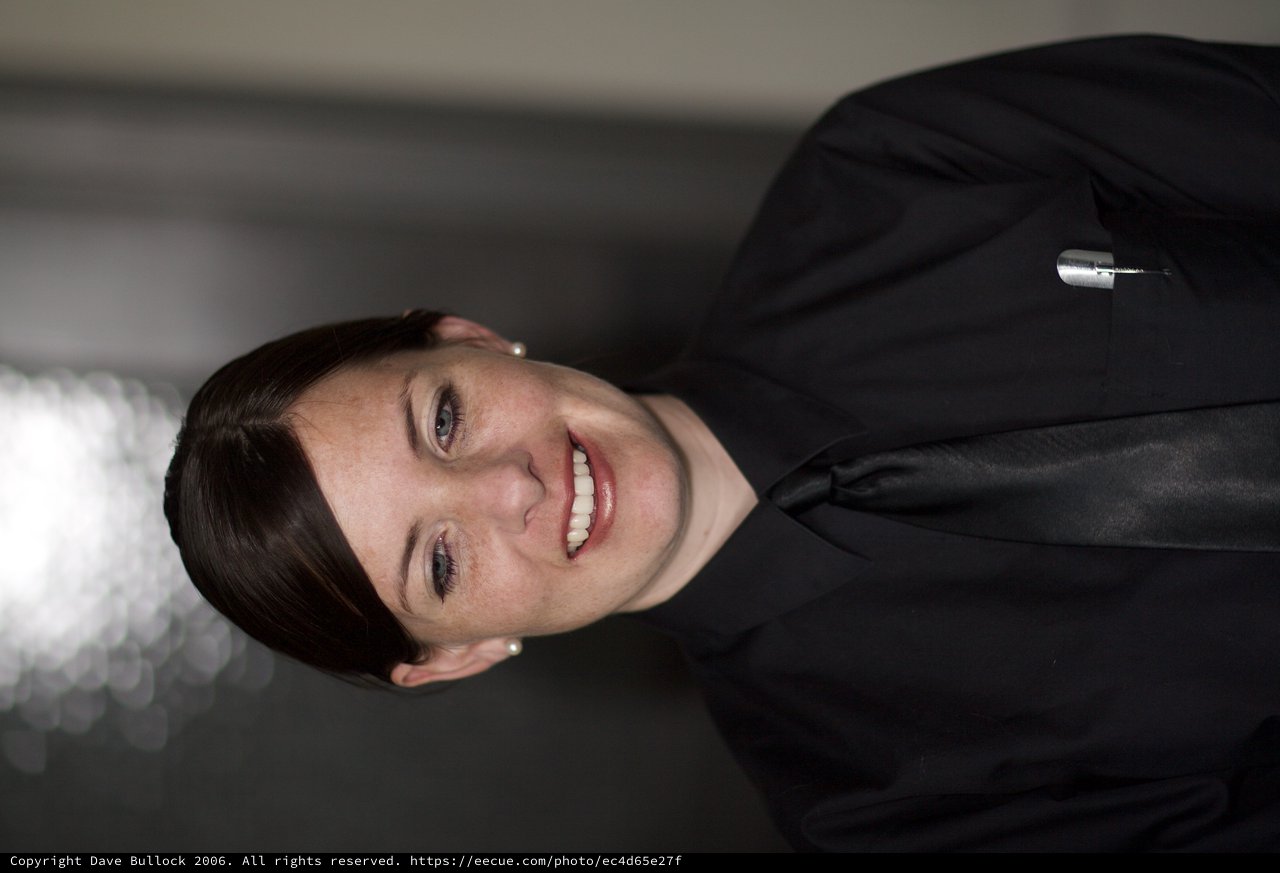 Smiling Woman in Black Uniform Portrait