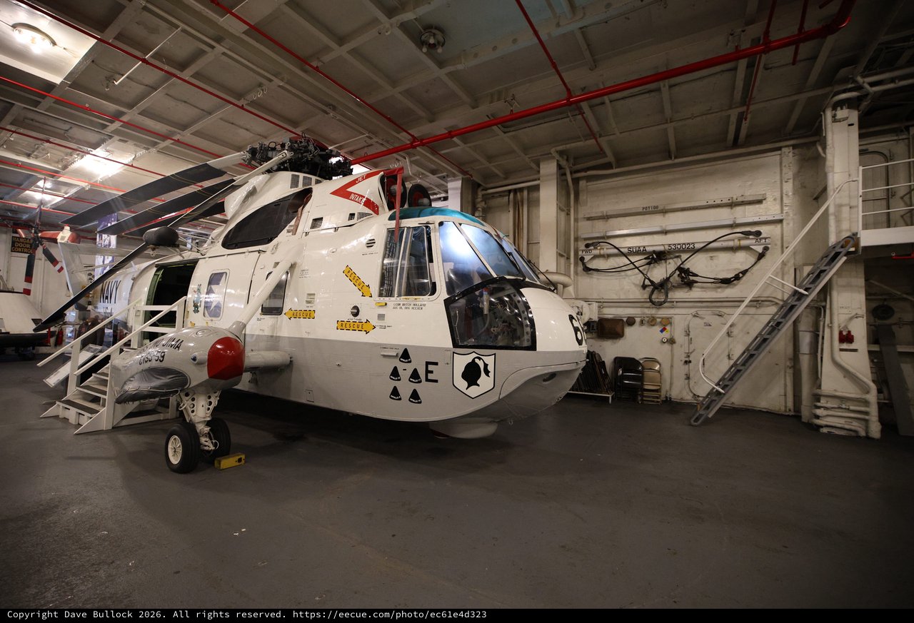 Military Helicopter in Aircraft Carrier Hangar Bay