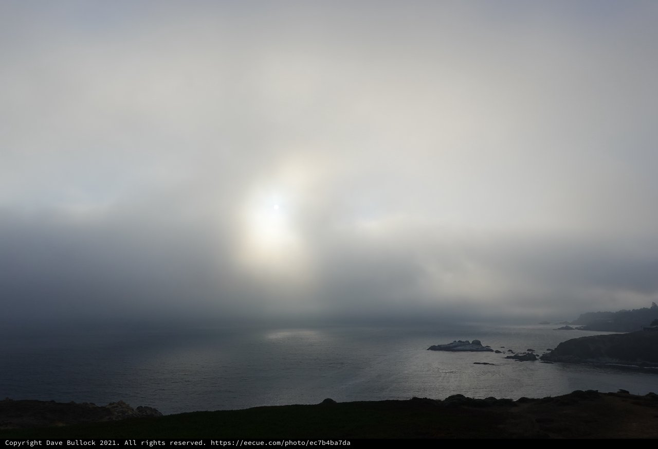 Moody Coastal Landscape Through Dramatic Fog