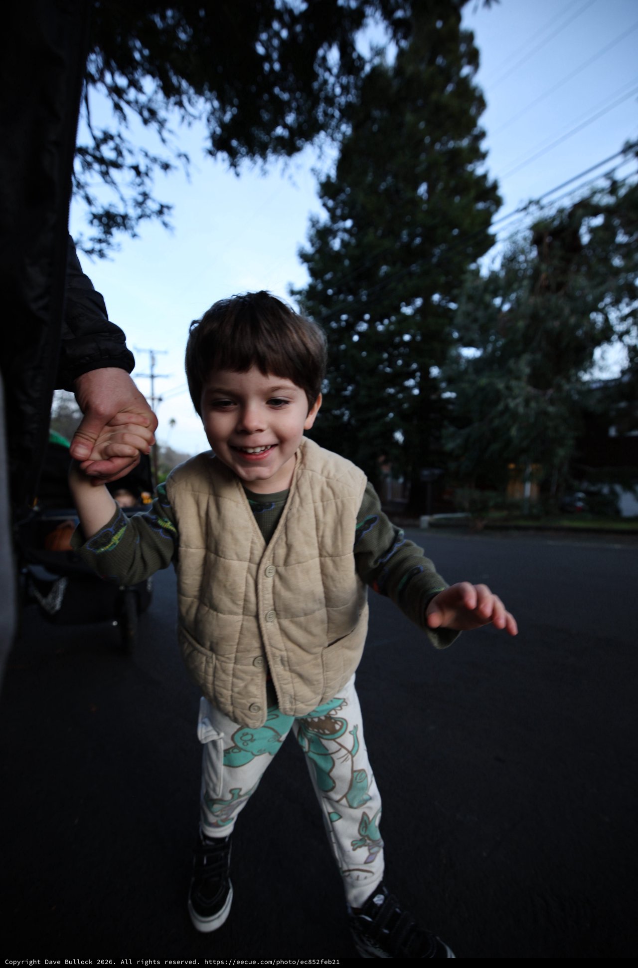 Child's Joyful Evening Walk in Suburban Neighborhood