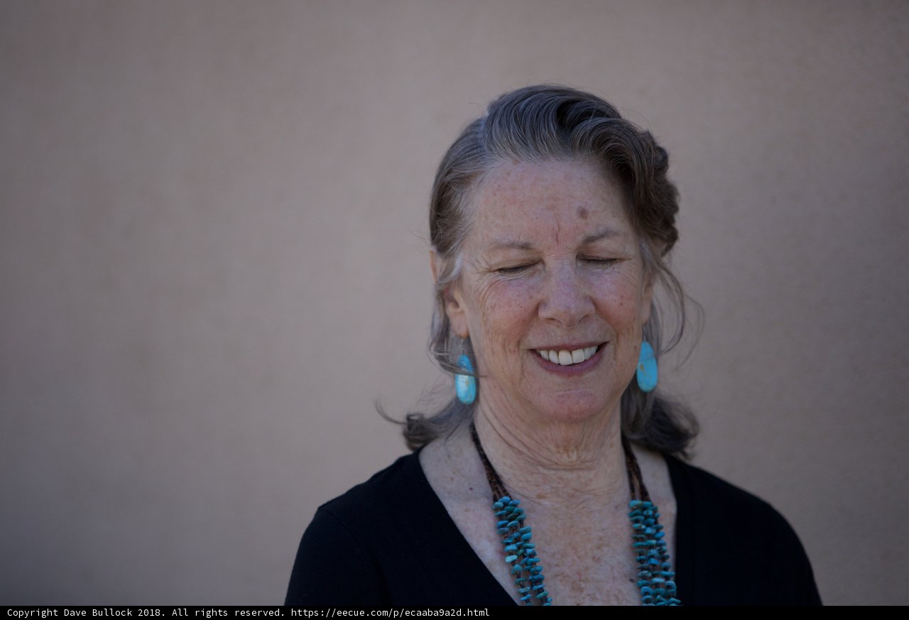 The Joyful Woman with Blue Earrings