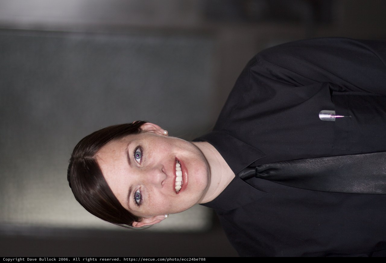 Professional Woman in Black Uniform Smiling Confidently