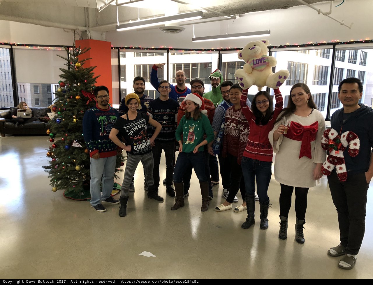 Office Team Celebrates Christmas with Ugly Sweaters