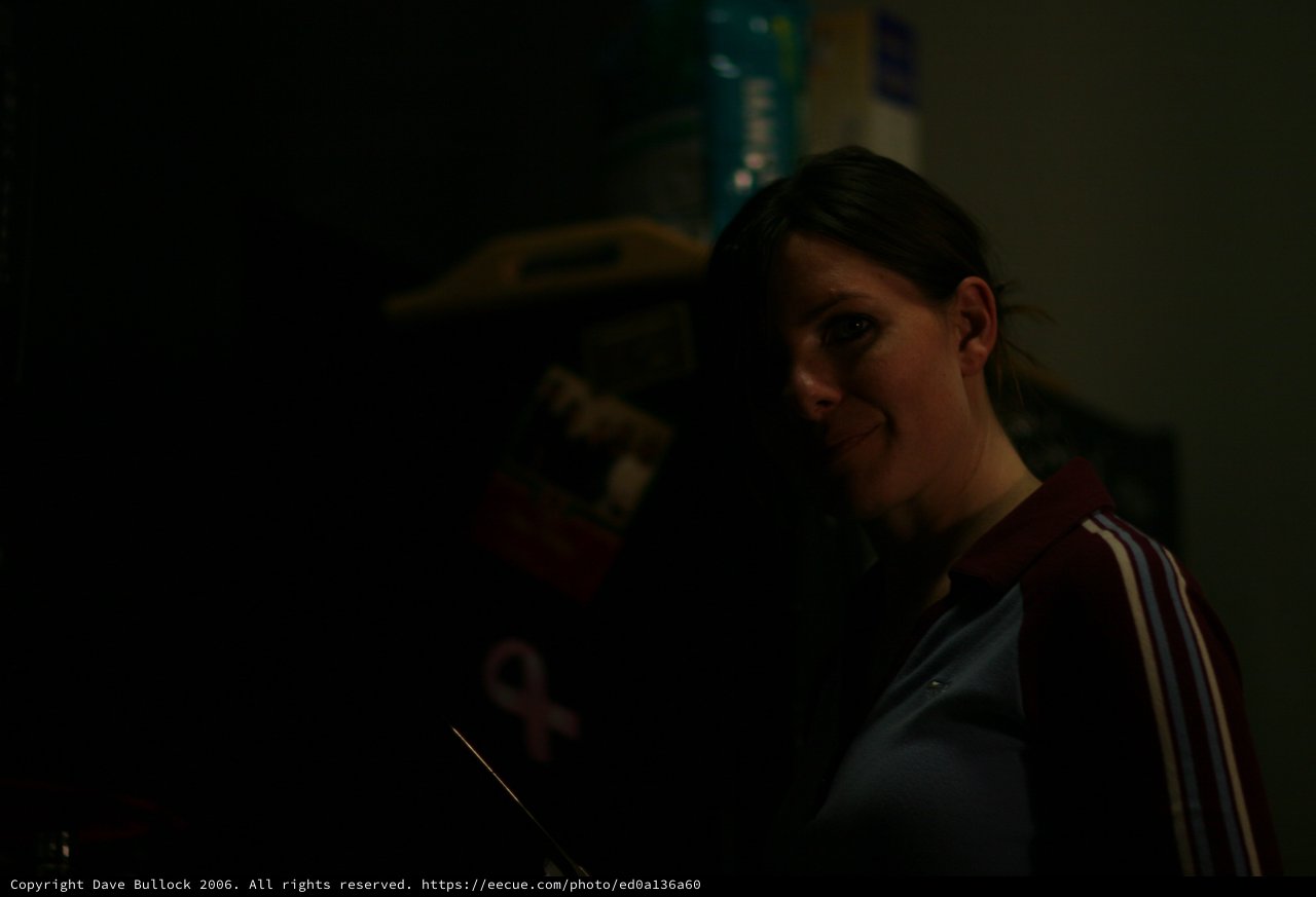 Penelope's Quiet Smile in Dim Indoor Light