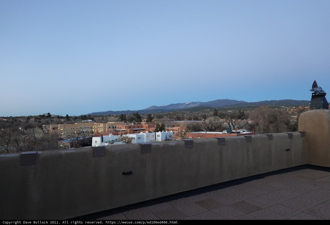 Mountainous cityscape from building rooftop