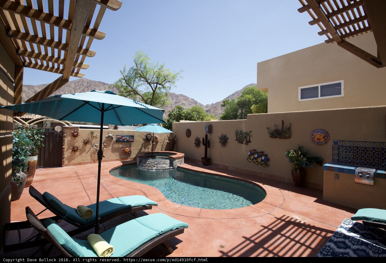 Relaxing Villa Patio with Pool and Umbrella
