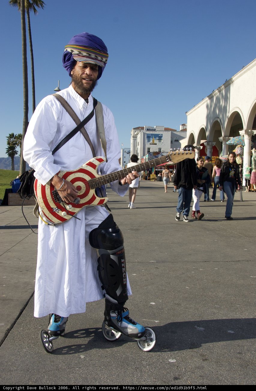 Turbaned Guitarist Rolls on Wheels