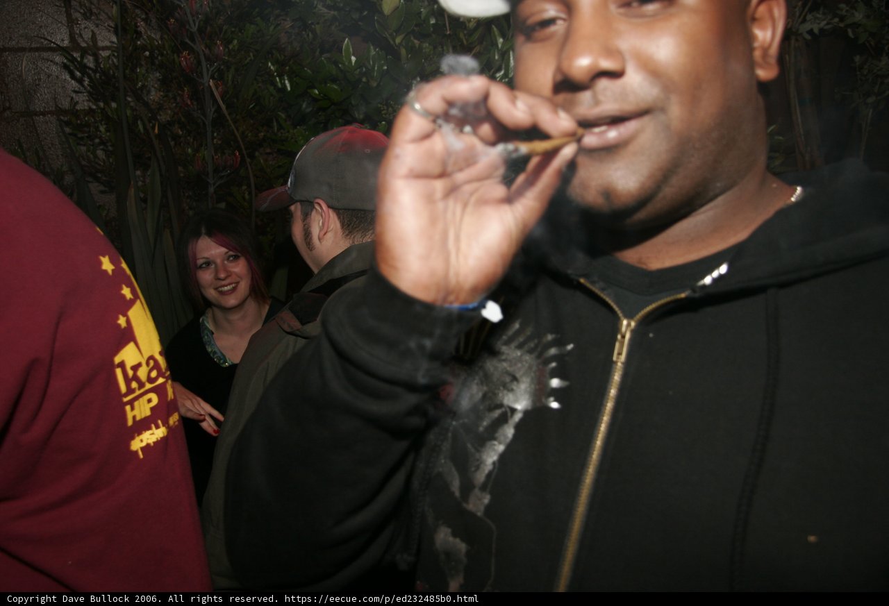 Smoking Man in Baseball Cap