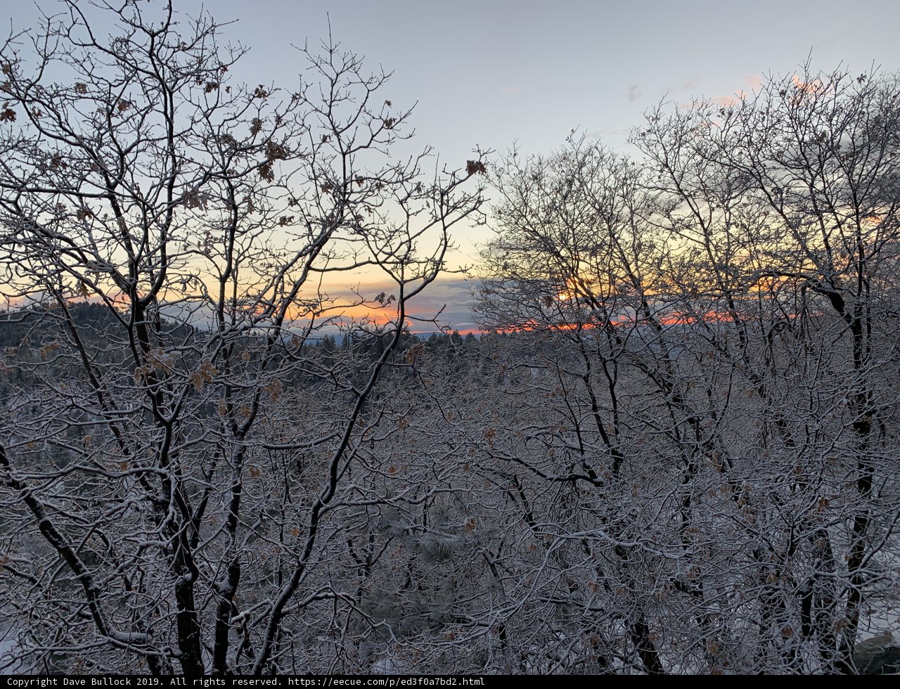 Winter Sunset Over Snowy Landscape