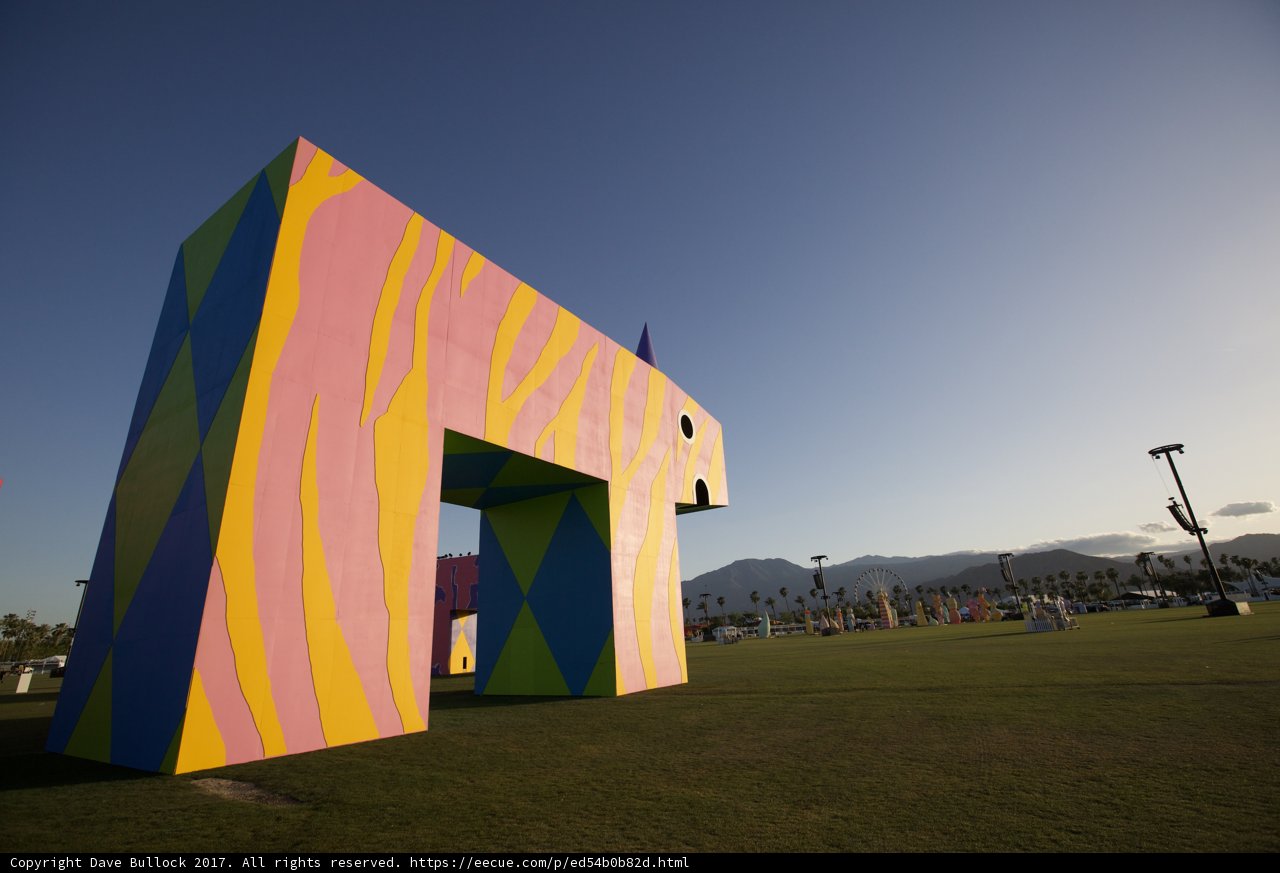 Colorful Horse Sculpture Stands Tall in Green Field