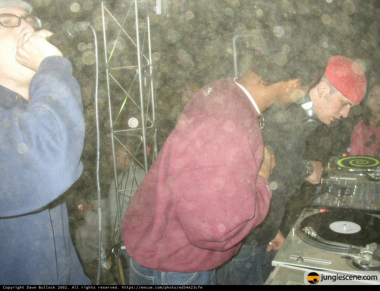 Red Shirted DJ Spinning Summer Vibes