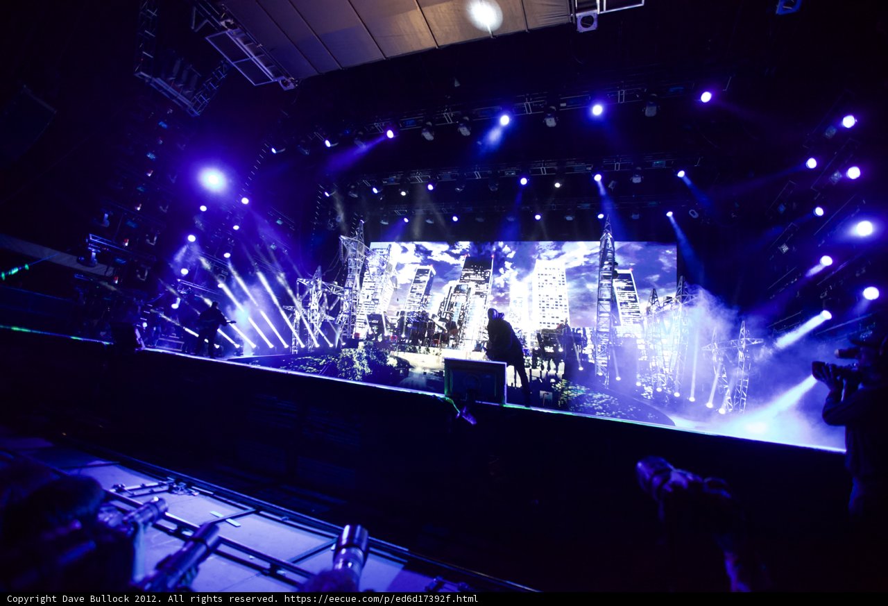 Purple Spotlight on Rock Concert Crowd