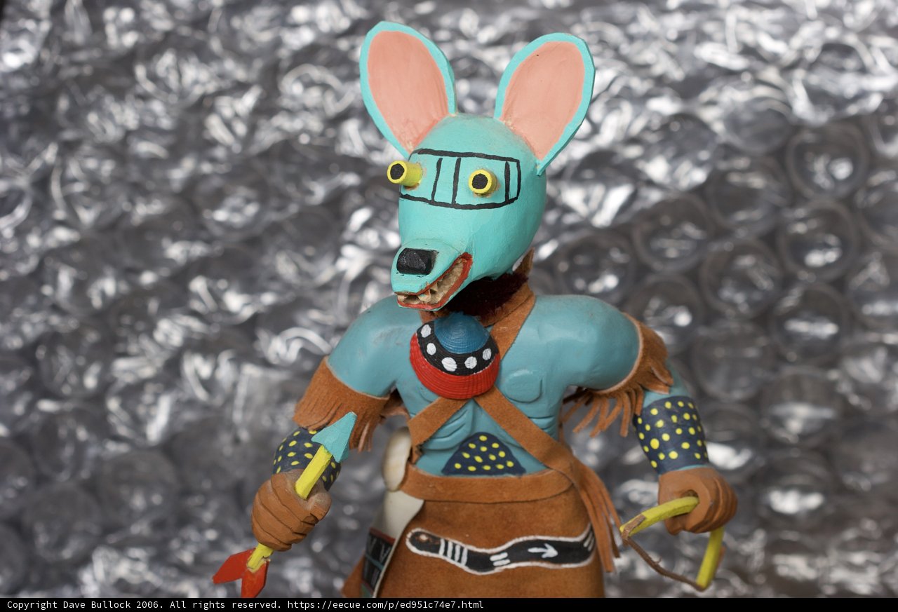 Blue and Orange Rabbit Figurine with a Knife