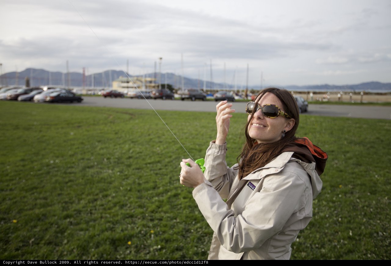 Woman Flying a Kite at San Francisco Waterfront