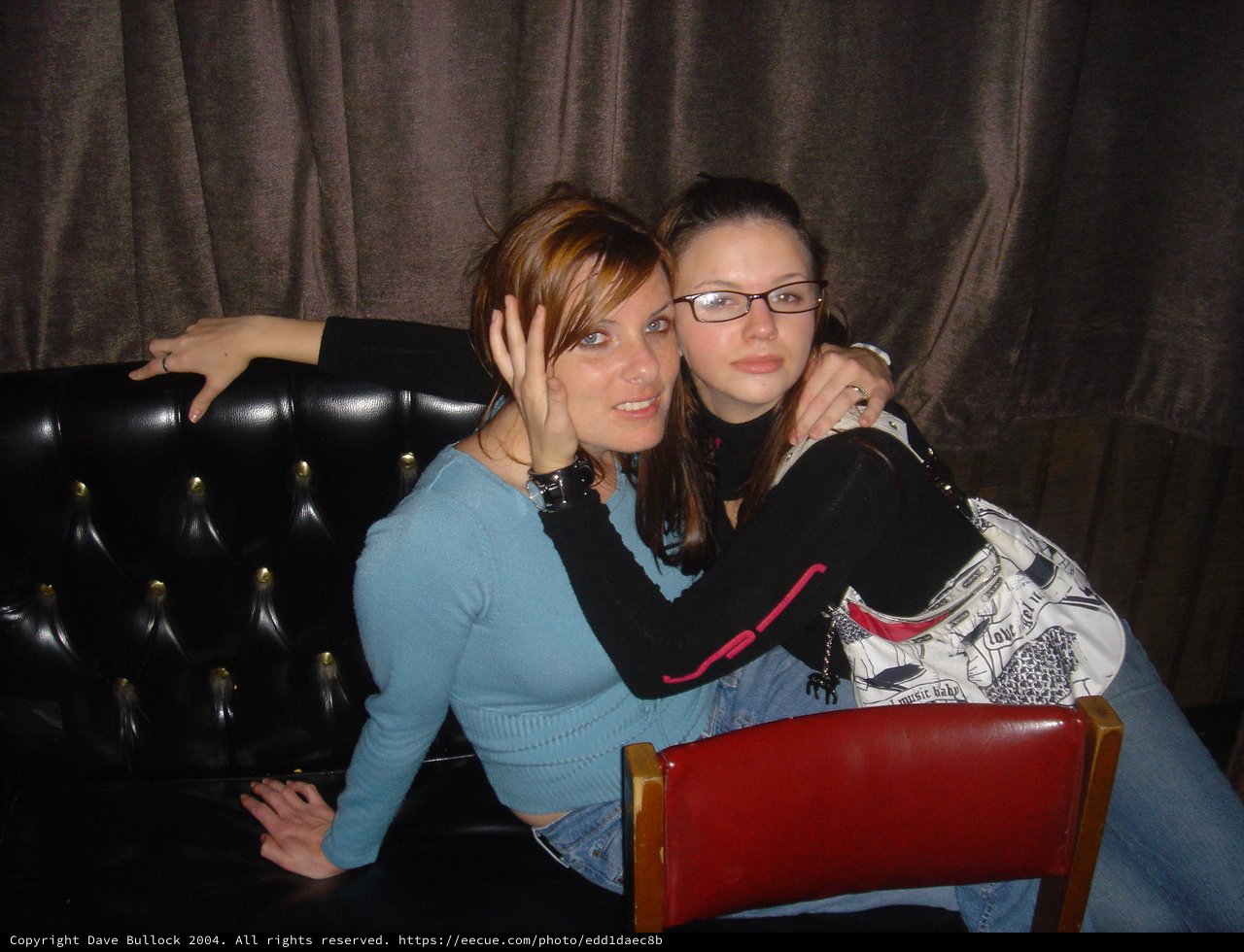 Two Friends Posing Together at a Bar Venue