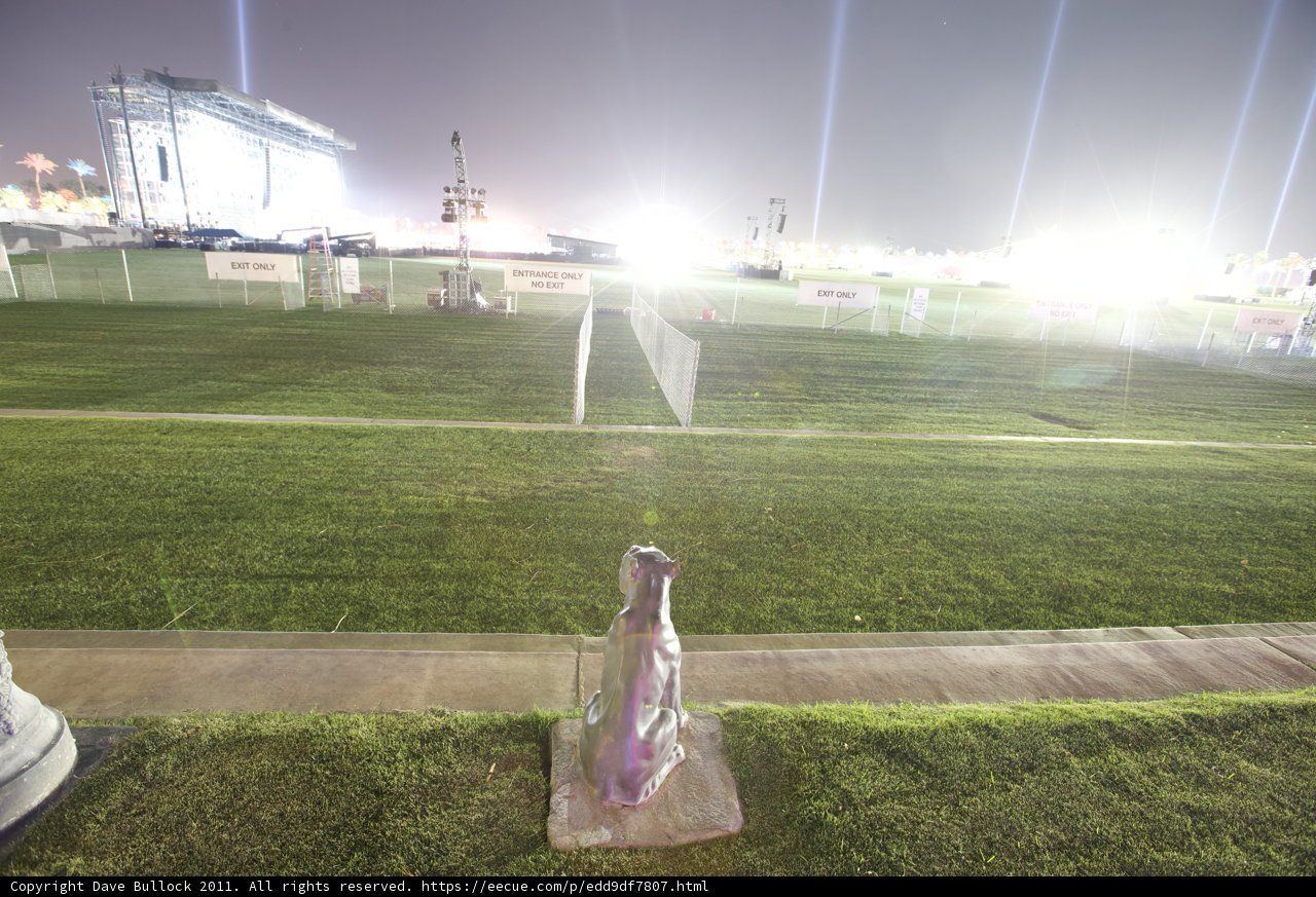 Bottle Statue on a Grassy Field