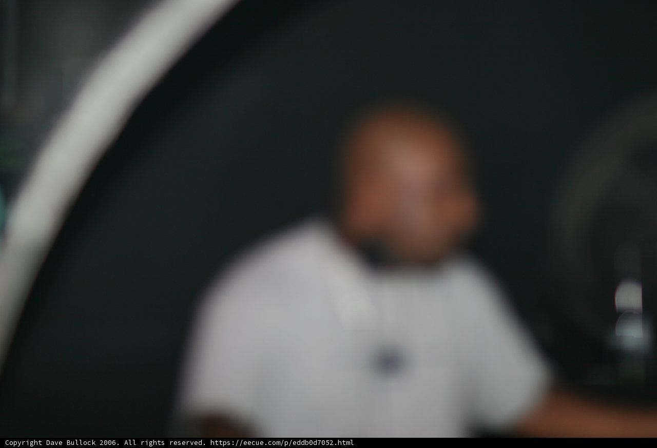 Blurry Man in White Shirt
