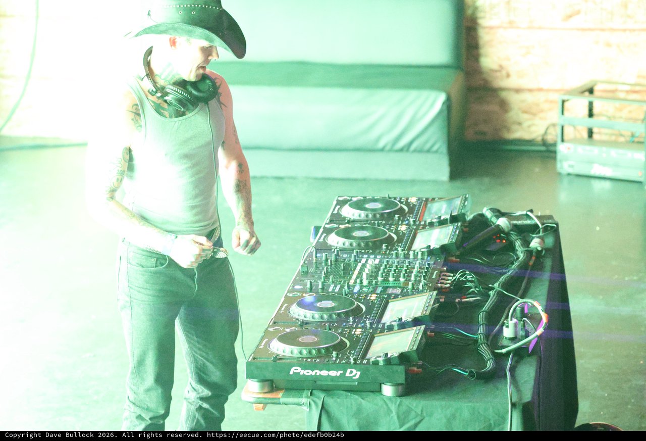 Tattooed DJ in Cowboy Hat at Pioneer Deck
