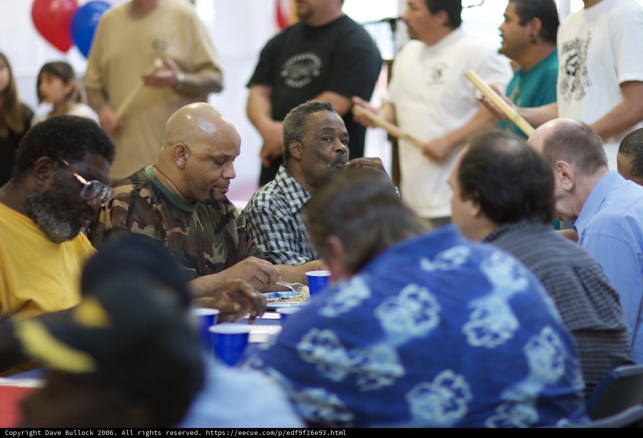 Crowd of 14 People Enjoying Refreshments
