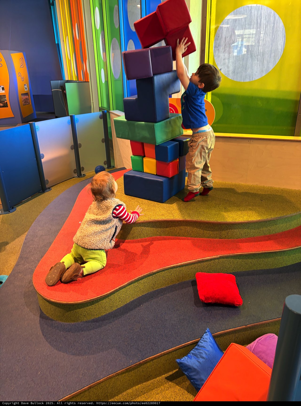 Children Building Tower with Oversized Foam Blocks