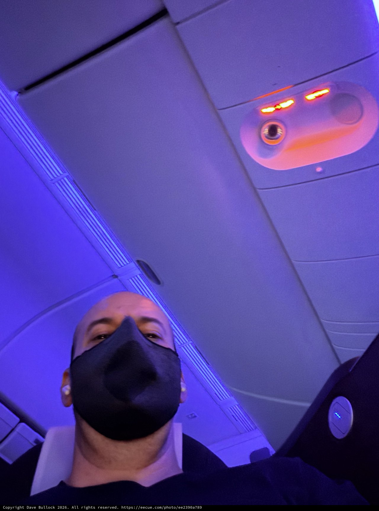 Selfie in Modern Aircraft Cabin with Ambient Purple Lighting