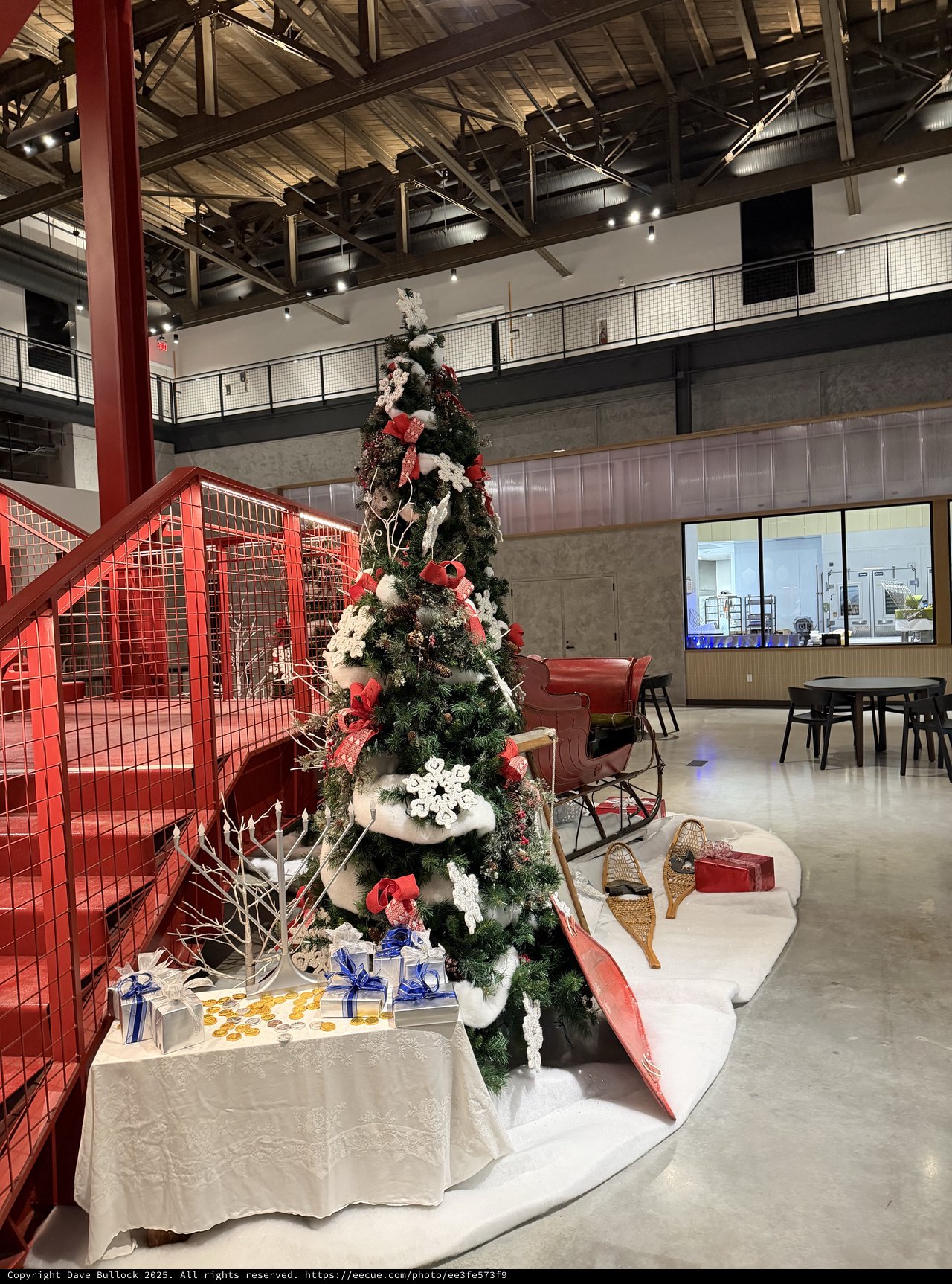 Festive Christmas Tree in Modern Industrial Office Lobby