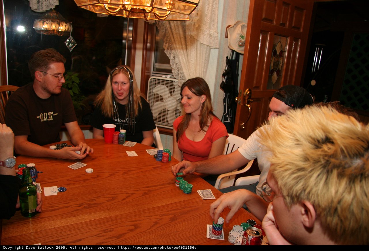 Friends Gathered Around Table for Home Poker Night