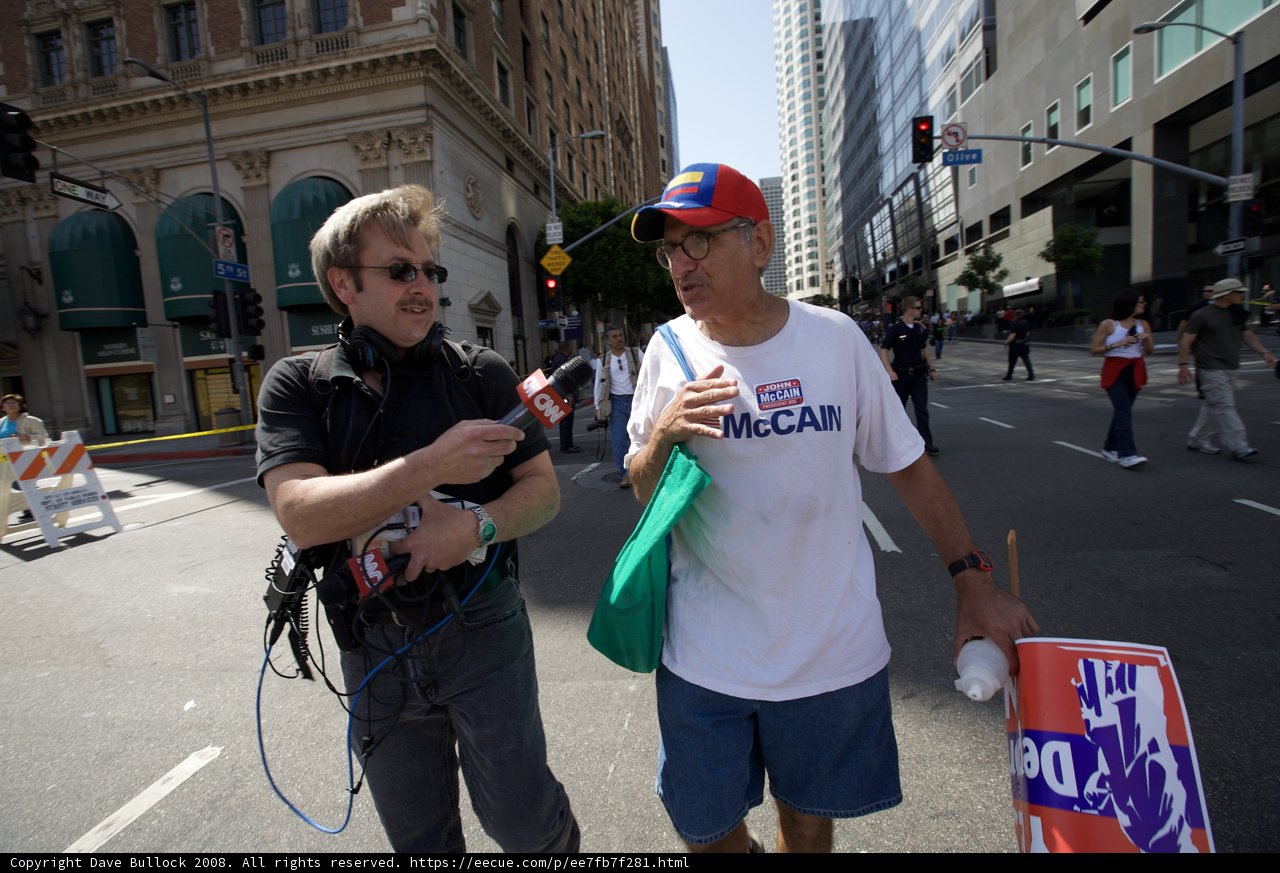 Mayday Rally Participant Holds Up Sign