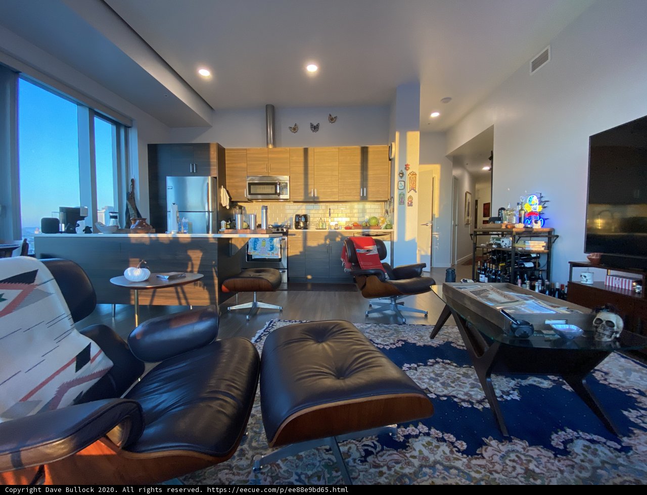 Contemporary Living Room with Large Window and Kitchen