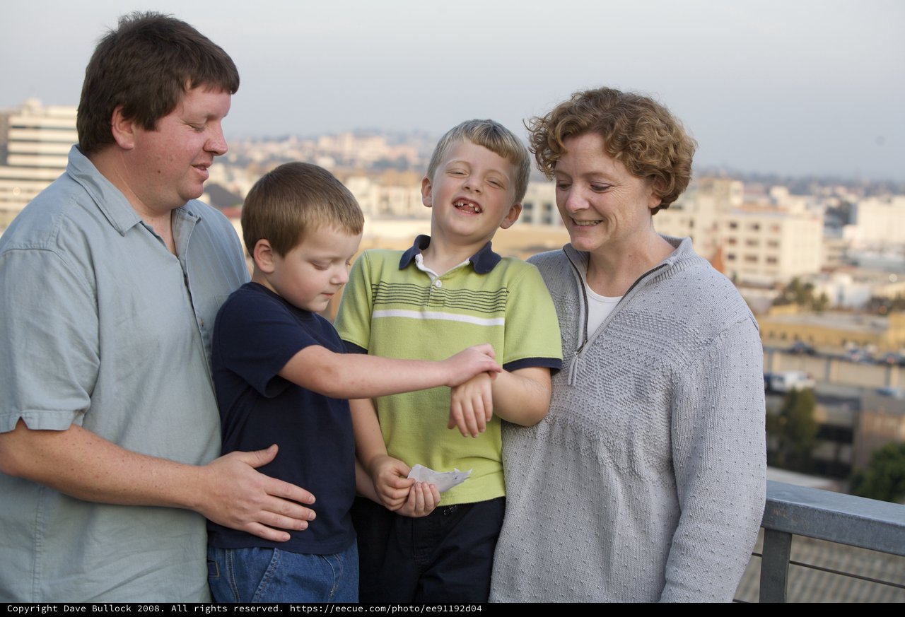Family Moment on City Rooftop at Dusk