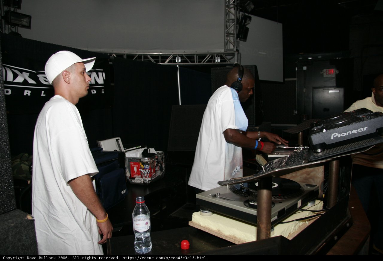 DJ S and friend behind the music table
