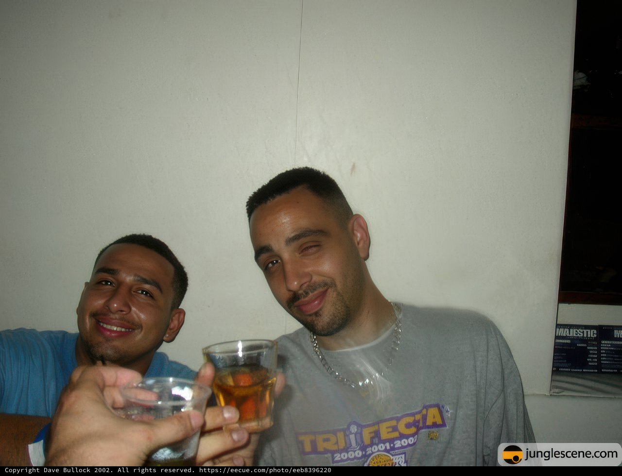 Two Men Toasting with a Glass of Lager