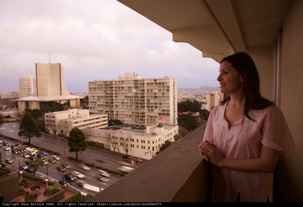 Woman Gazes Over San Francisco Cityscape at Dusk