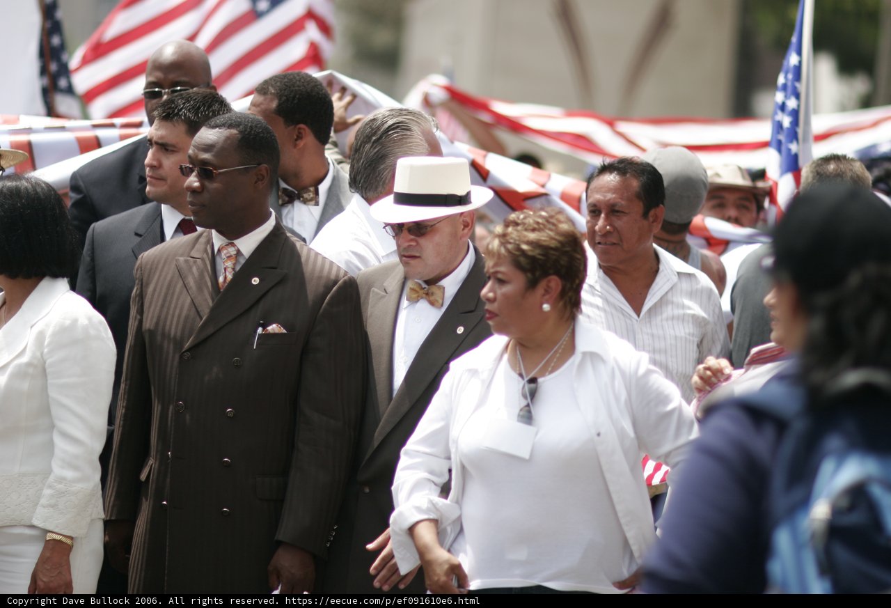 A Formal Crowd Walks Down the Street