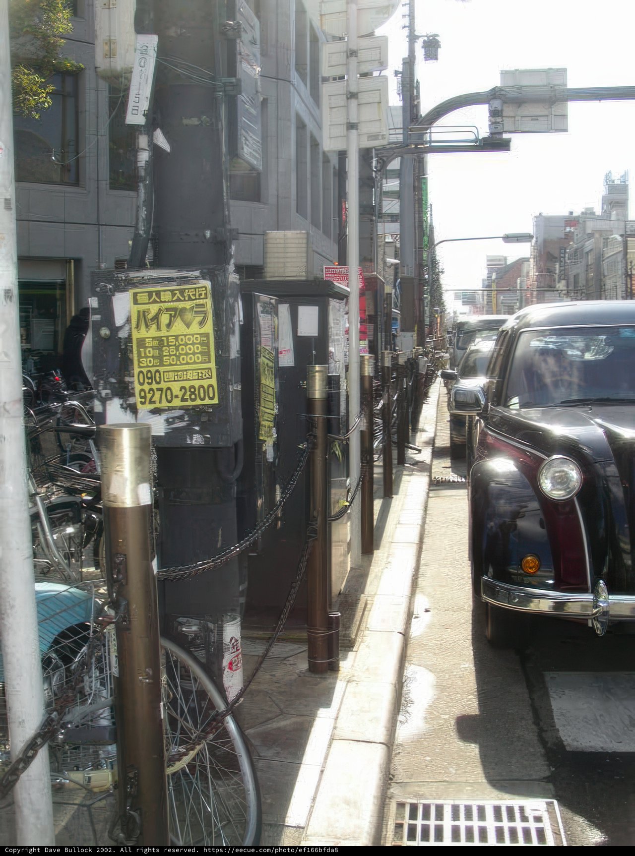 Parked Black Car on an Urban Street