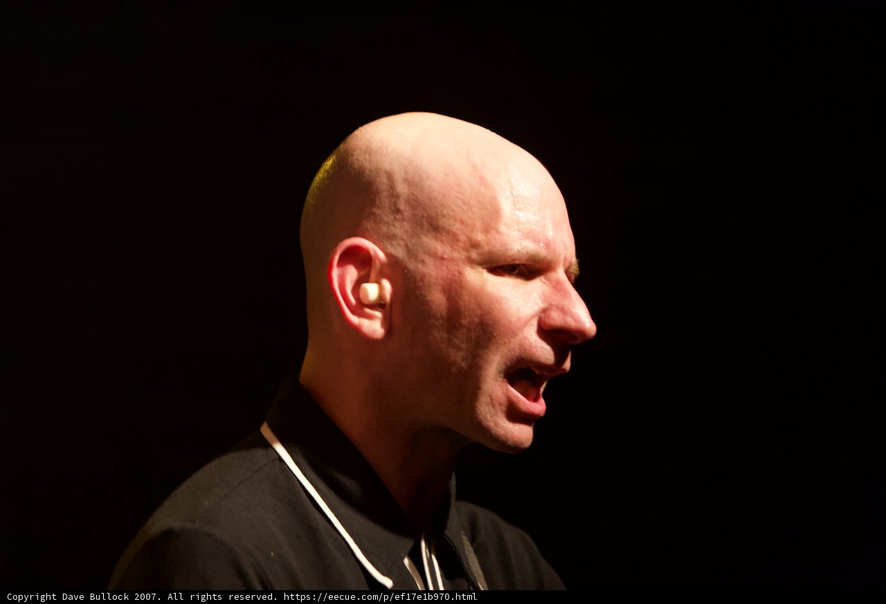The Bold Bald Man on the Mic