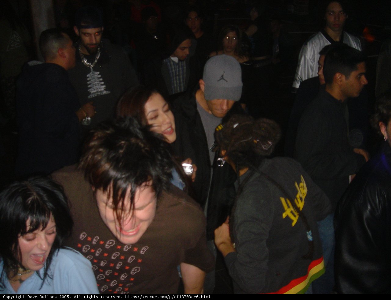 Man in Black Jacket among Urban Crowd