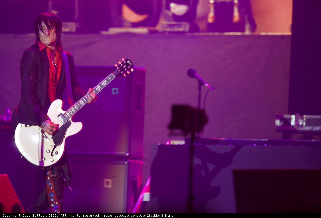 The Suited Guitarist Rocks the Stage