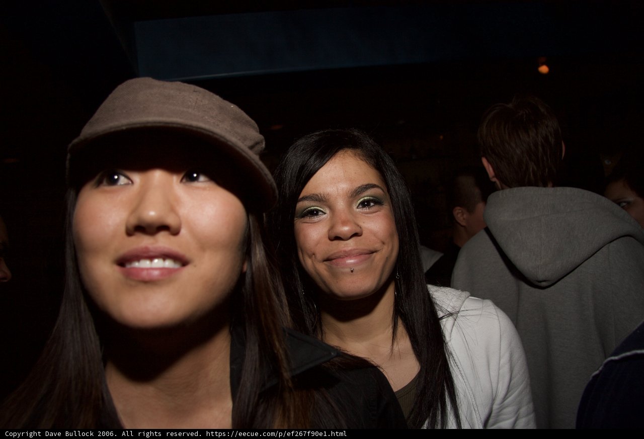 Smiling Women in Baseball Caps