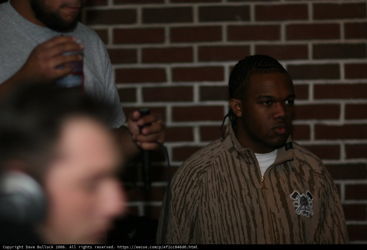 Dreadlocked Man Against Brick Wall