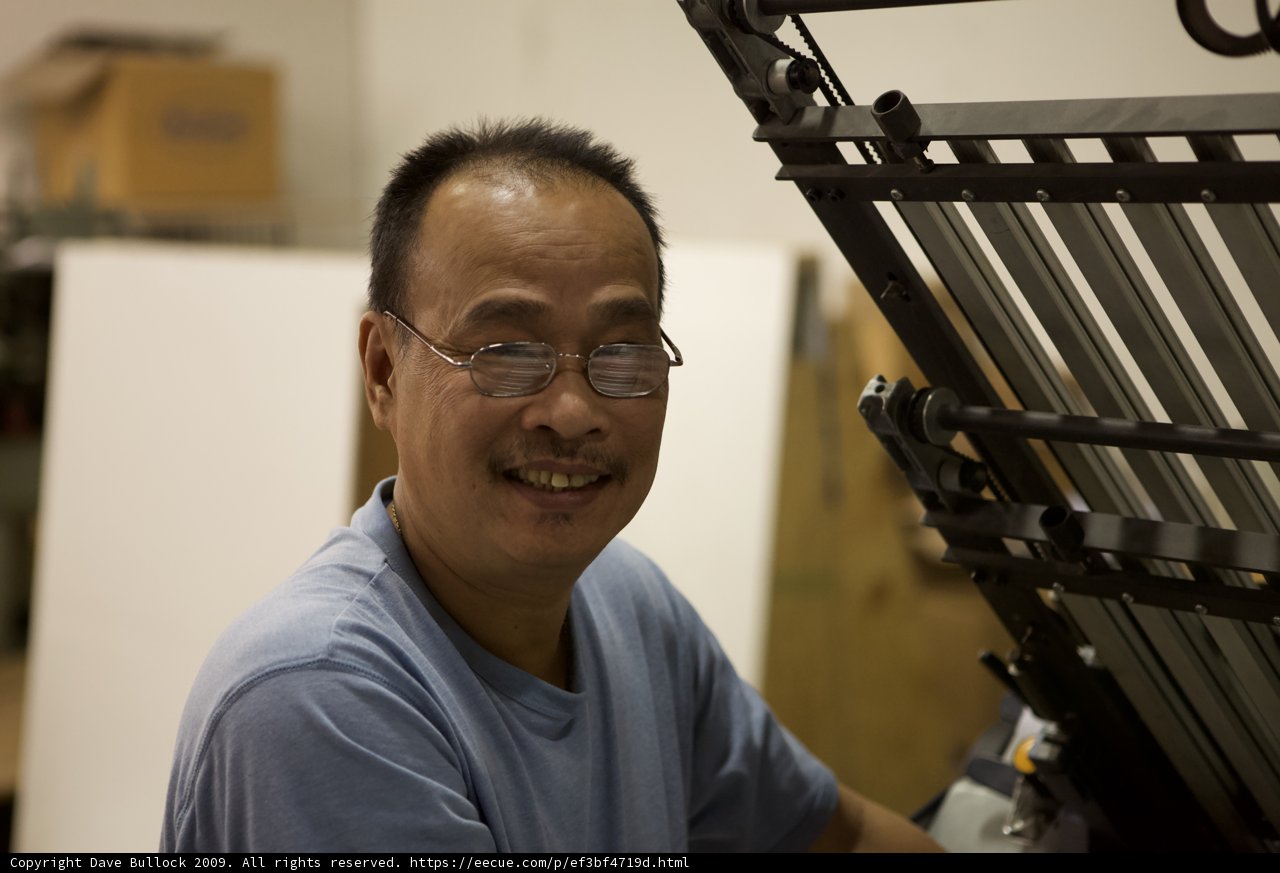 Smiling Man at the Printing Machine