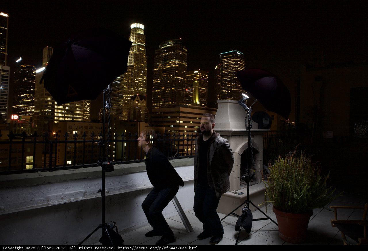 Two Men Capturing the Metropolis at Night