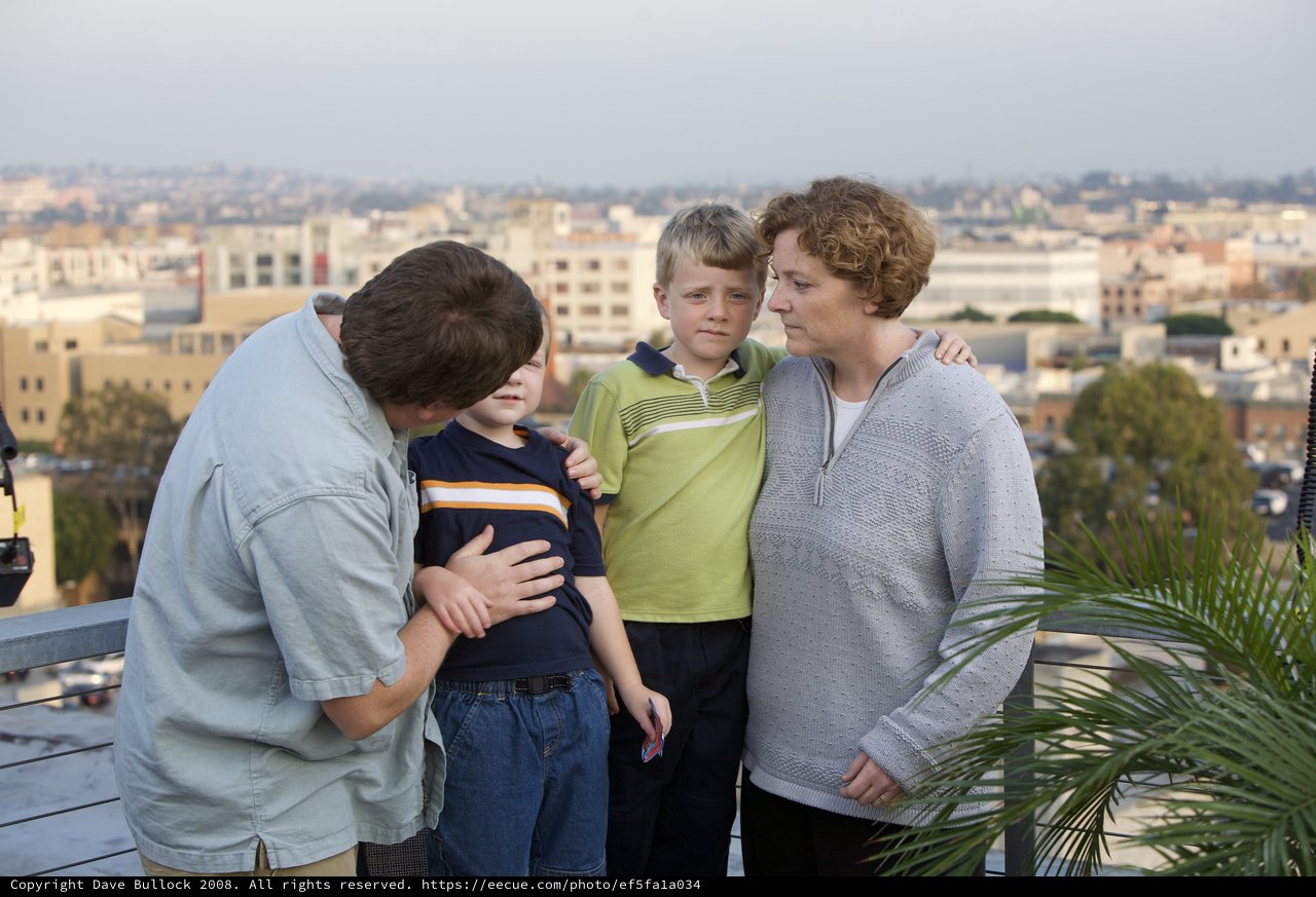 Family Moment on Urban Rooftop Overlooking City
