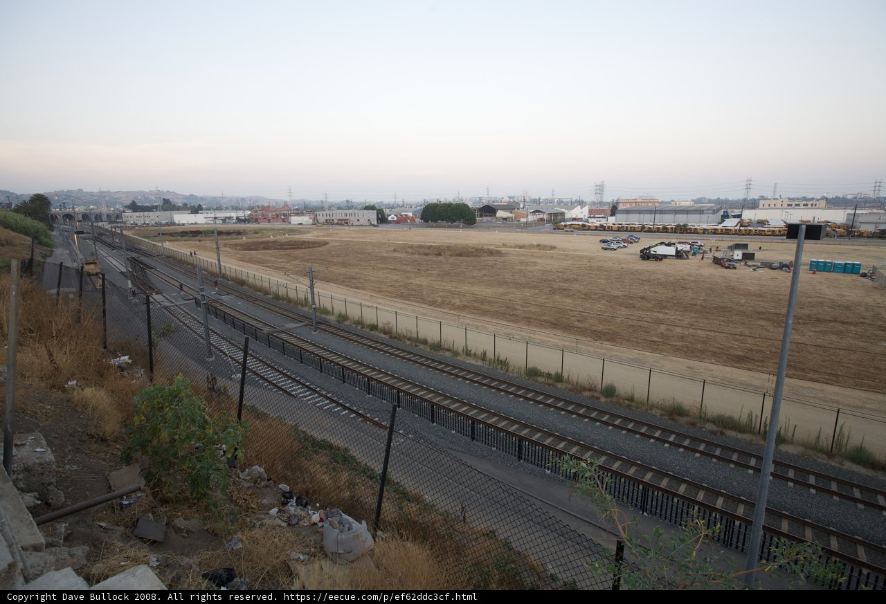 Railroad Tracks and Fence on a Summer Day
