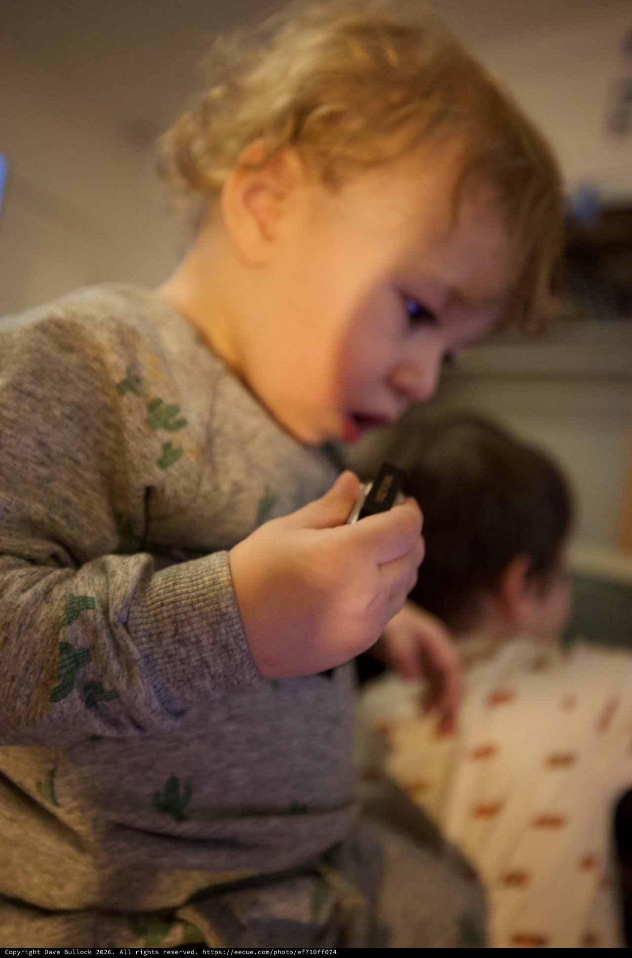 Young Child Eating Pizza in Cozy Home Setting